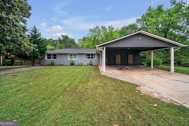 ranch-style house with concrete driveway, a front lawn, brick siding, and a carport