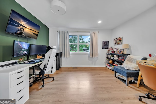 office space with recessed lighting, light wood-type flooring, and baseboards