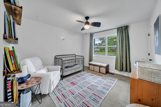 carpeted bedroom with a ceiling fan