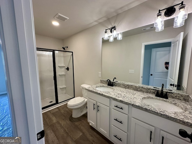 full bath with wood finished floors, visible vents, and a sink