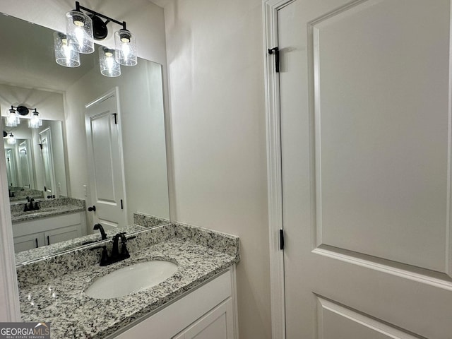 bathroom with two vanities and a sink