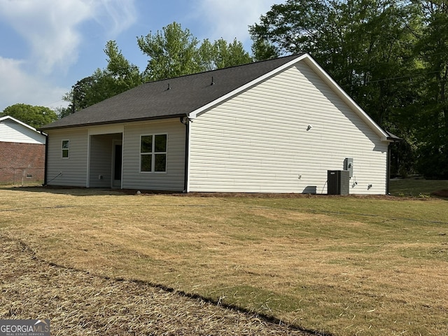 rear view of house with a lawn