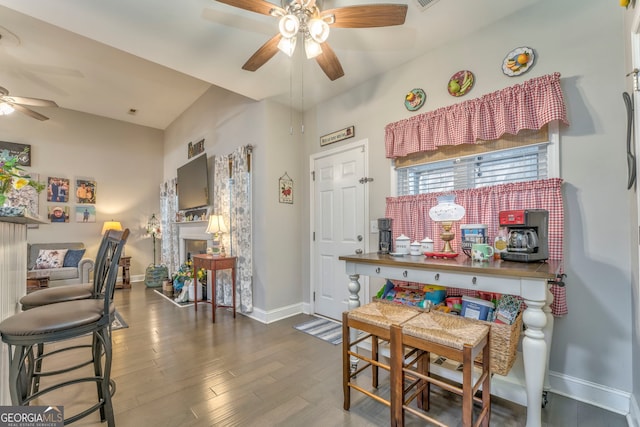 11 Bush Arbor Pl SW, Rome, GA 30165 - dining room featuring a fireplace, baseboards, wood finished floors, and ceiling fan