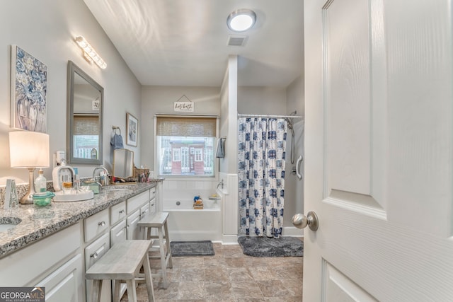 11 Bush Arbor Pl SW, Rome, GA 30165 - full bathroom featuring visible vents, a shower with shower curtain, a sink, double vanity, and a garden tub