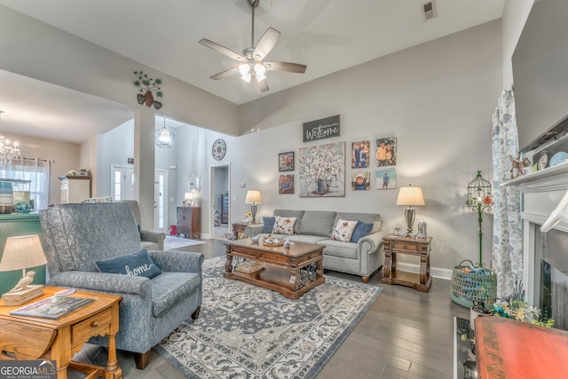 11 Bush Arbor Pl SW, Rome, GA 30165 - living area with visible vents, baseboards, a fireplace, wood finished floors, and ceiling fan with notable chandelier
