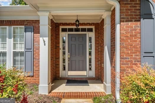 1330 Badingham Dr, Cumming, GA 30041 - view of exterior entry with brick siding