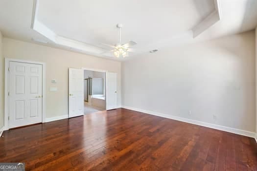 1330 Badingham Dr, Cumming, GA 30041 - empty room featuring a ceiling fan and wood finished floors