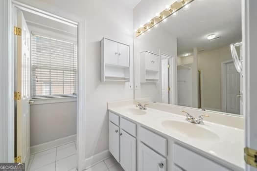 1330 Badingham Dr, Cumming, GA 30041 - full bathroom featuring double vanity and tile patterned floors