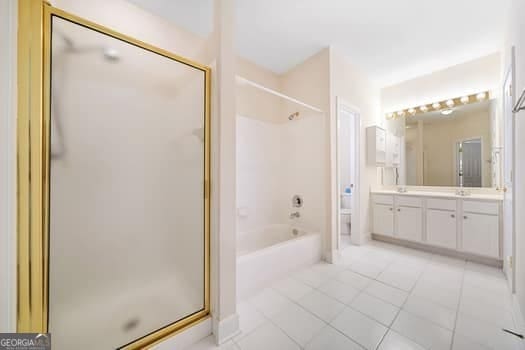 1330 Badingham Dr, Cumming, GA 30041 - full bathroom featuring vanity, tile patterned flooring, and  shower combination