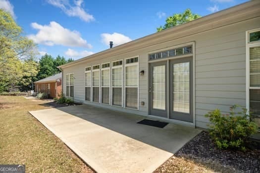 1330 Badingham Dr, Cumming, GA 30041 - doorway to property with a patio