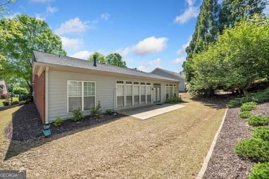1330 Badingham Dr, Cumming, GA 30041 - rear view of house with a patio
