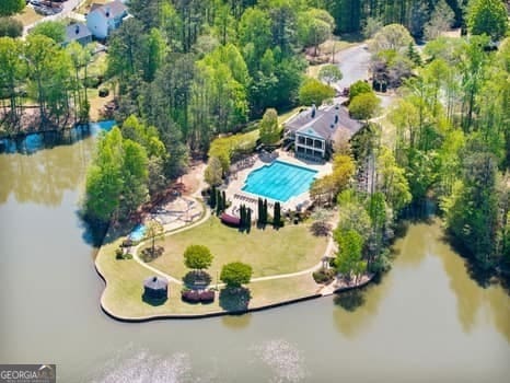 1330 Badingham Dr, Cumming, GA 30041 - drone / aerial view of a pool area and a nearby body of water