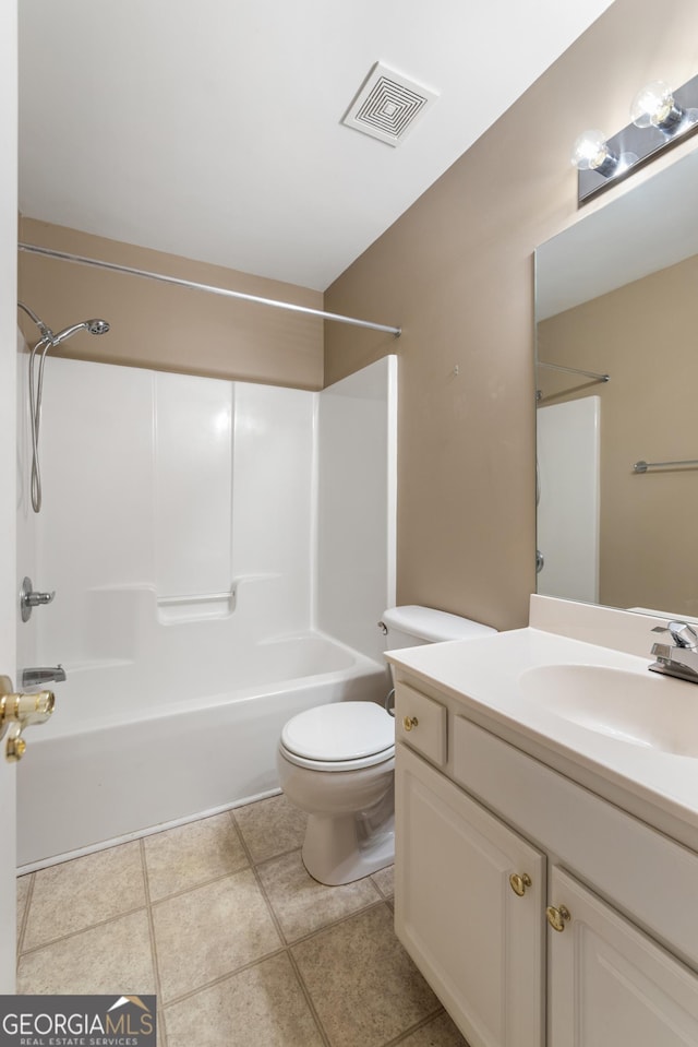 bathroom with visible vents, toilet, vanity, and bathing tub / shower combination