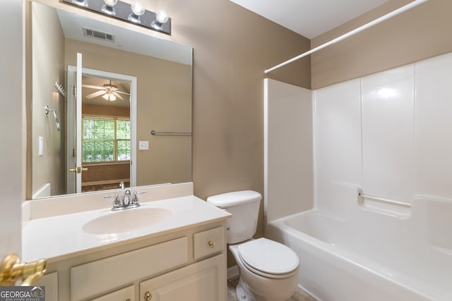 full bath with ceiling fan, shower / washtub combination, vanity, visible vents, and toilet