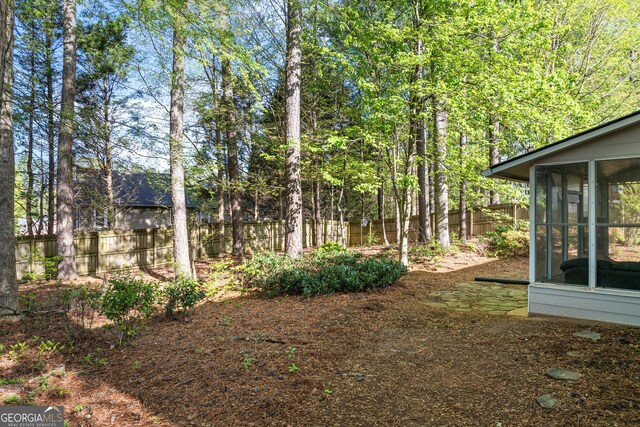 1035 Bridle Path Dr, Lawrenceville, GA 30045 - view of yard with a sunroom
