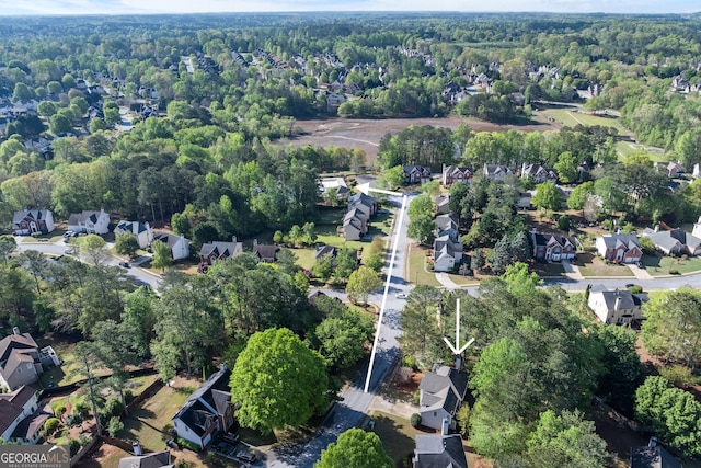 drone / aerial view with a residential view and a forest view