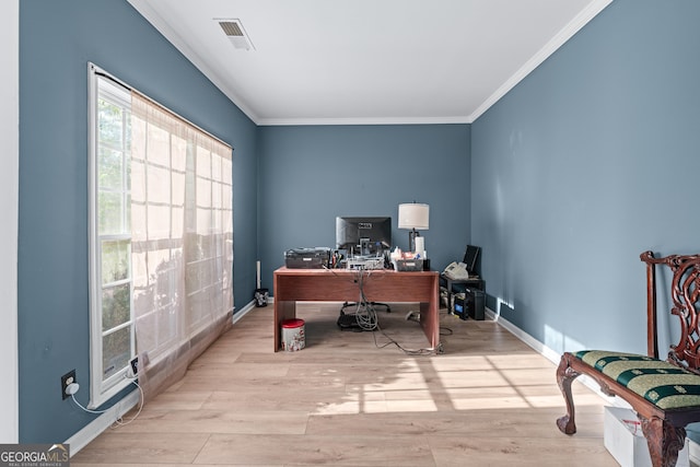 office with ornamental molding, visible vents, baseboards, and wood finished floors