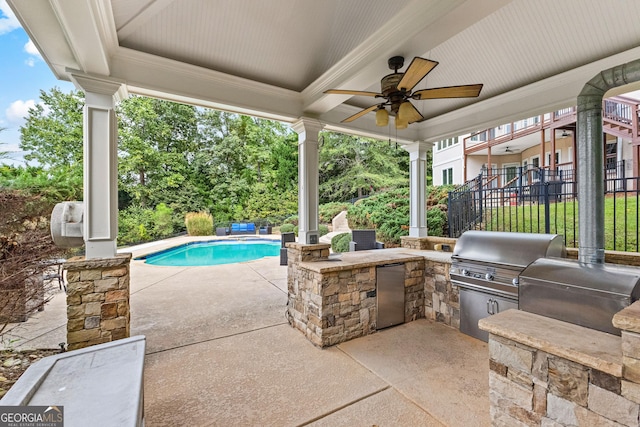 12 Arbor Shrs, Newnan, GA 30265 - view of patio / terrace featuring exterior kitchen, a ceiling fan, and an outdoor pool