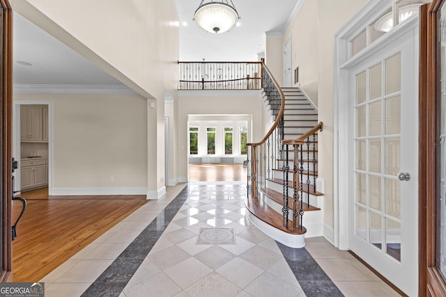 12 Arbor Shrs, Newnan, GA 30265 - tiled entryway featuring inlaid floor details, crown molding, stairway, and french doors