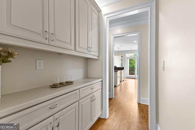 12 Arbor Shrs, Newnan, GA 30265 - hallway with light wood-style floors and crown molding
