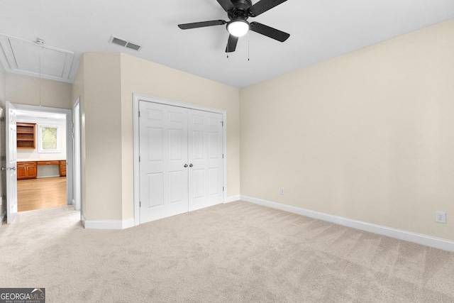12 Arbor Shrs, Newnan, GA 30265 - unfurnished bedroom with attic access, carpet floors, a closet, and ceiling fan