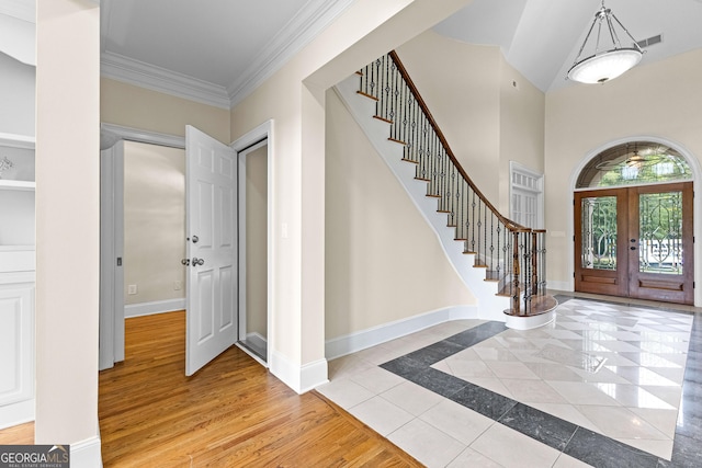 12 Arbor Shrs, Newnan, GA 30265 - foyer featuring french doors, stairway, crown molding, and light tile patterned floors