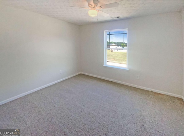 empty room featuring baseboards, a ceiling fan, and carpet floors