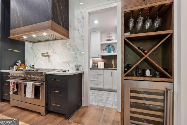 448 Golden Bear Pass, Dahlonega, GA 30533 - wine room featuring beverage cooler, light wood finished floors, and a bar