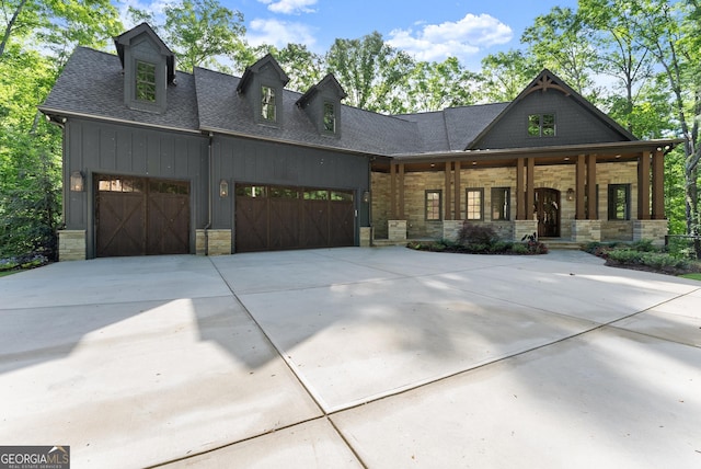448 Golden Bear Pass, Dahlonega, GA 30533 - modern farmhouse style home with stone siding, an attached garage, driveway, covered porch, and a shingled roof