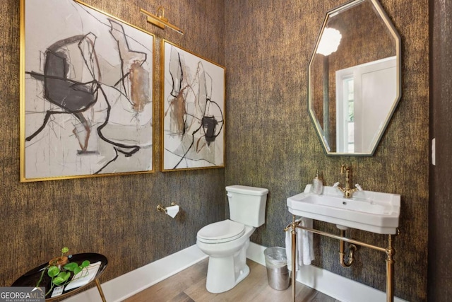 448 Golden Bear Pass, Dahlonega, GA 30533 - bathroom featuring toilet, a sink, wood finished floors, and baseboards