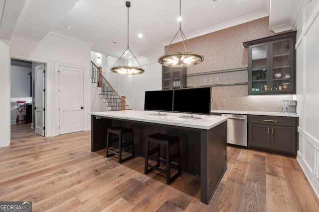 448 Golden Bear Pass, Dahlonega, GA 30533 - kitchen featuring stainless steel dishwasher, crown molding, a center island, a kitchen breakfast bar, and glass insert cabinets