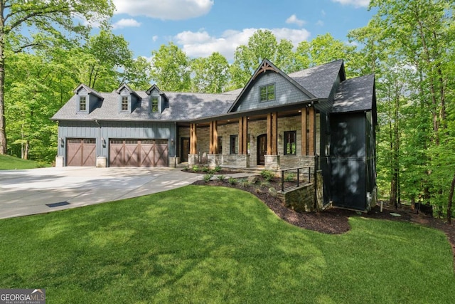448 Golden Bear Pass, Dahlonega, GA 30533 - view of front of house with covered porch, an attached garage, driveway, a front yard, and stone siding