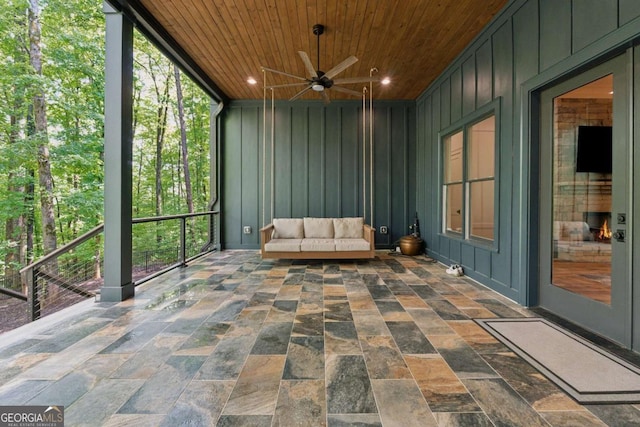 448 Golden Bear Pass, Dahlonega, GA 30533 - sunroom featuring ceiling fan, wooden ceiling, stone finish floors, a decorative wall, and recessed lighting