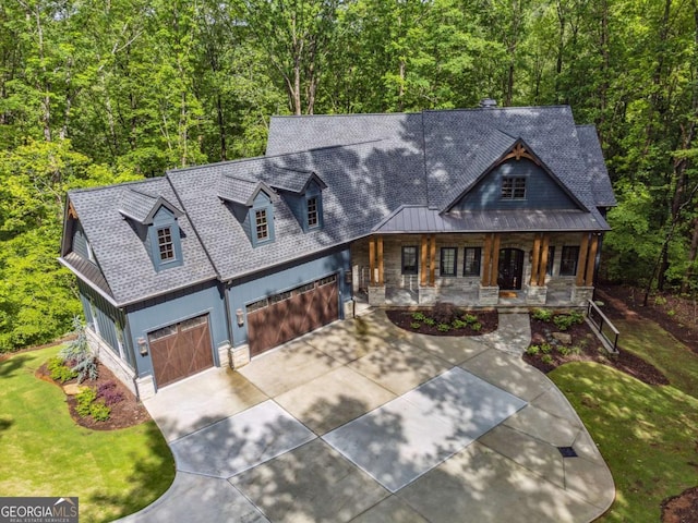 448 Golden Bear Pass, Dahlonega, GA 30533 - view of front facade with a porch, concrete driveway, stone siding, and a front lawn