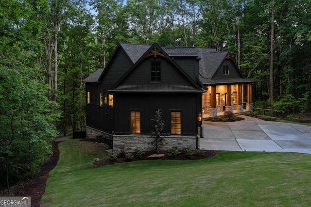 448 Golden Bear Pass, Dahlonega, GA 30533 - craftsman-style home featuring board and batten siding, stone siding, a front lawn, a porch, and driveway