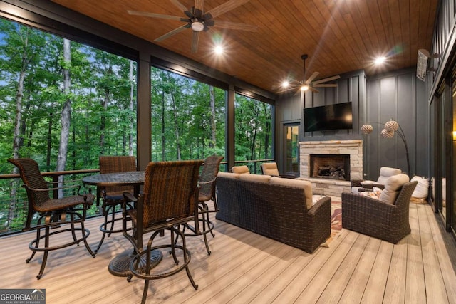 448 Golden Bear Pass, Dahlonega, GA 30533 - wooden deck featuring a ceiling fan and an outdoor living space with a fireplace