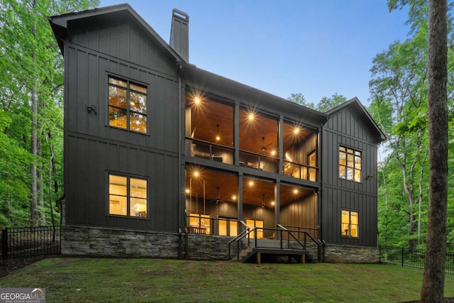 448 Golden Bear Pass, Dahlonega, GA 30533 - rear view of property featuring board and batten siding, a chimney, and stone siding