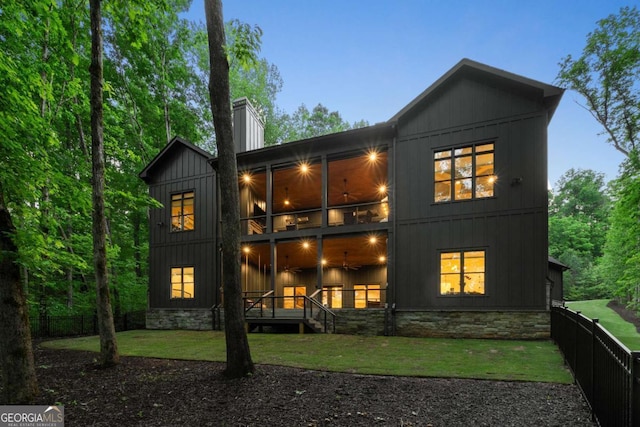 448 Golden Bear Pass, Dahlonega, GA 30533 - back of house featuring ceiling fan, a chimney, board and batten siding, and a balcony