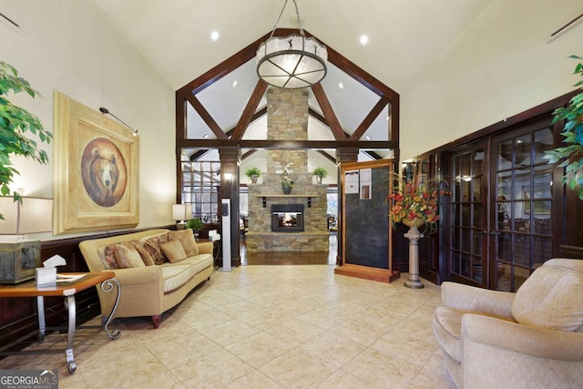 448 Golden Bear Pass, Dahlonega, GA 30533 - living room featuring high vaulted ceiling, a stone fireplace, recessed lighting, and tile patterned flooring