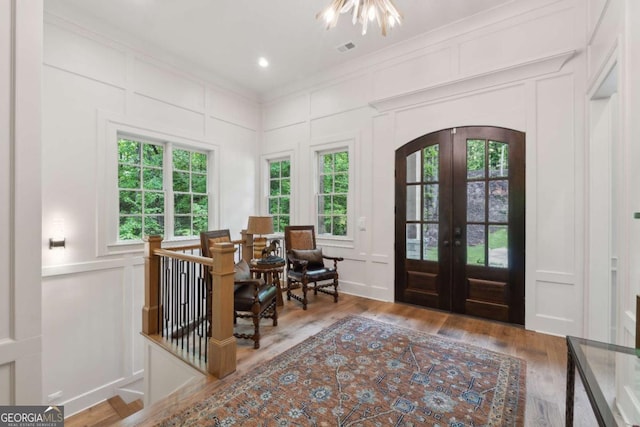 448 Golden Bear Pass, Dahlonega, GA 30533 - entryway with a decorative wall, french doors, healthy amount of natural light, crown molding, and wood finished floors