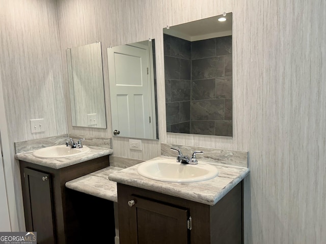 bathroom featuring two vanities and a sink