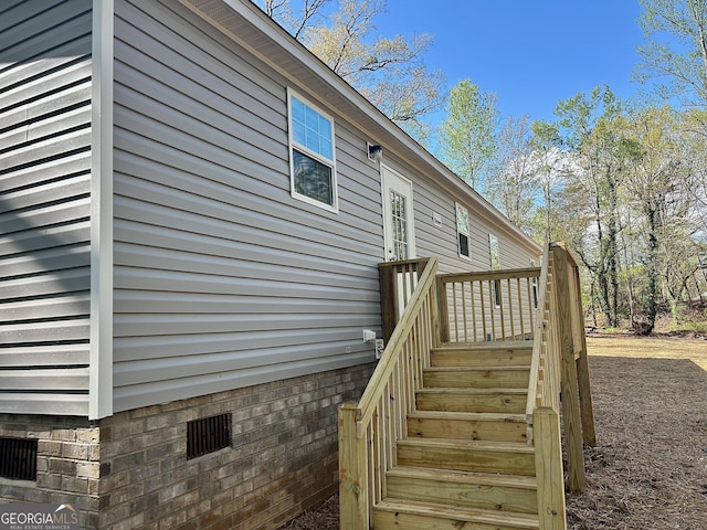 view of side of property featuring crawl space