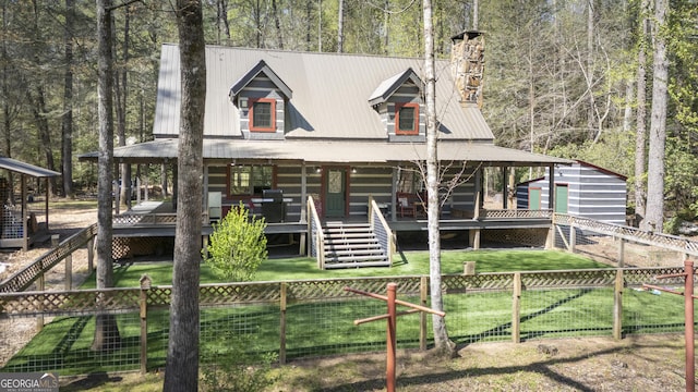 1323 Hooper Rd, Cleveland, GA 30528 - view of front of property with a fenced backyard, a front yard, and metal roof