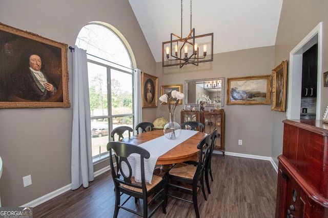 dining room featuring baseboards, high vaulted ceiling, a notable chandelier, and dark wood-style flooring