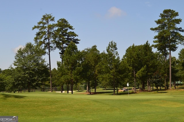 view of home's community featuring a lawn