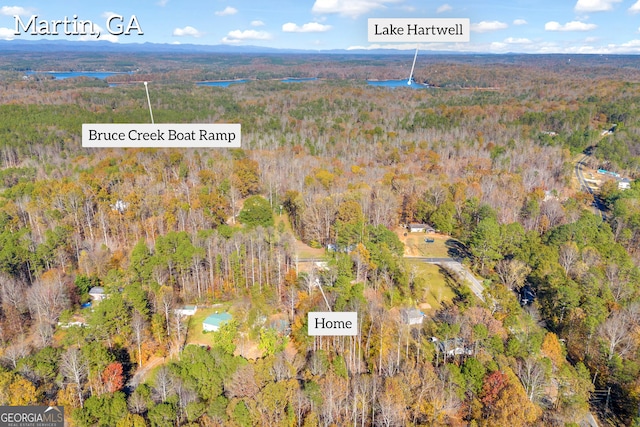 aerial view featuring a wooded view