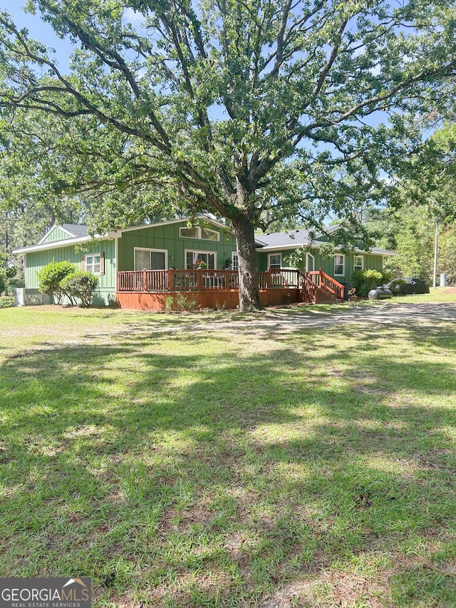 3411 Ponderosa Rd, Portal, GA 30450 - view of grassy yard featuring a wooden deck