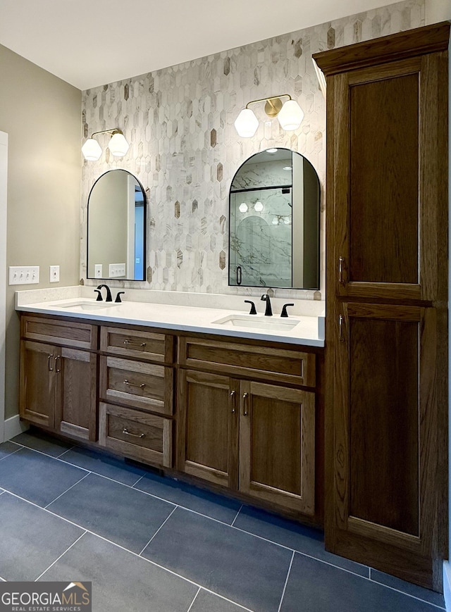 full bathroom featuring walk in shower, tile patterned floors, and a sink