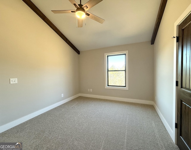 unfurnished room with baseboards, carpet, and lofted ceiling