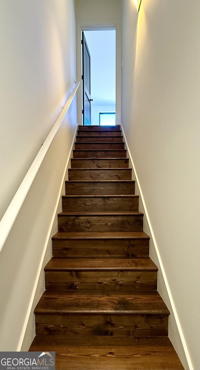 stairs with wood finished floors